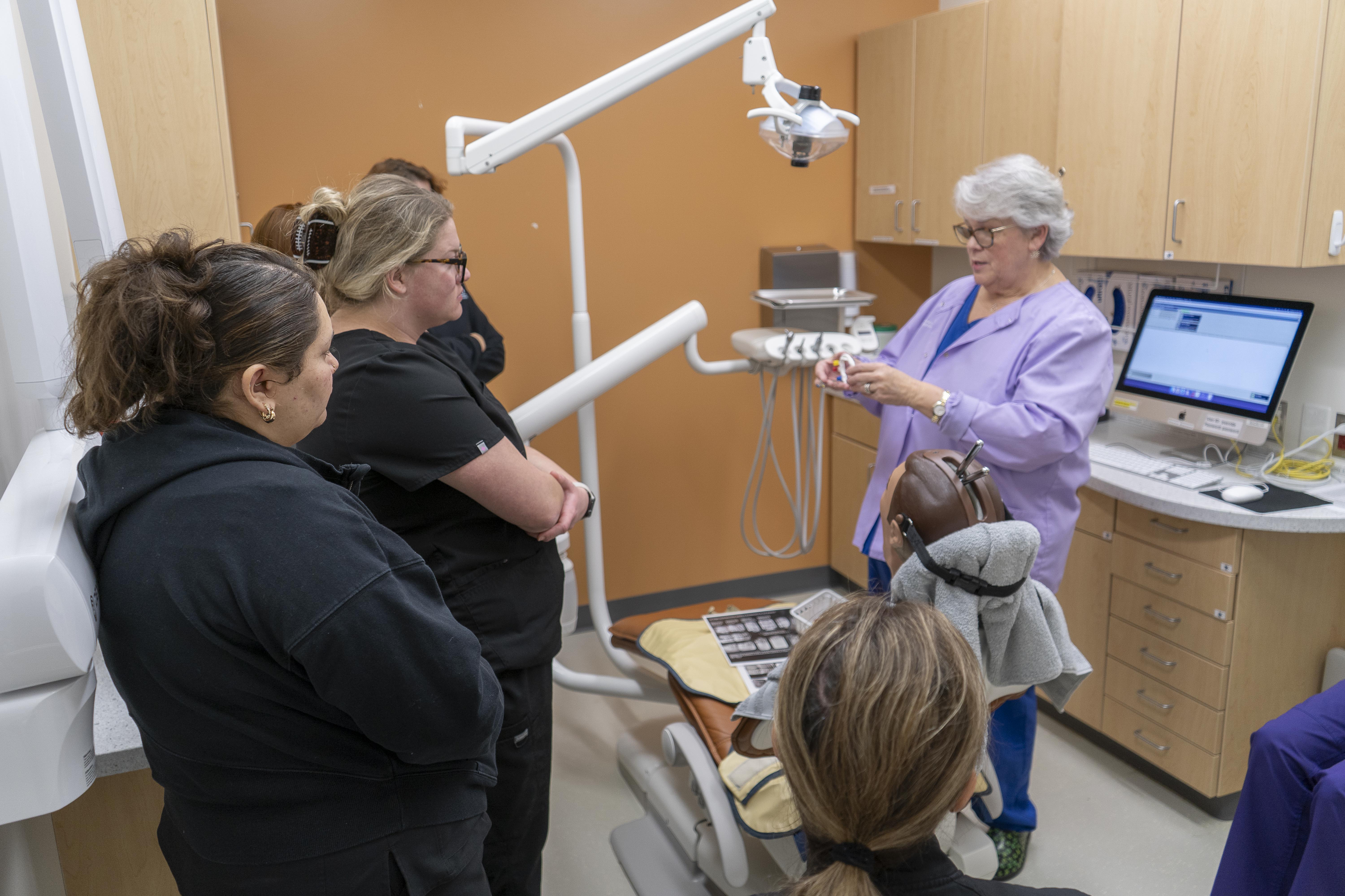Dental School instructor sharing about the wall mounted x ray 